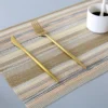 Placemat Atque E warna kuning 30x45 cm digunakan sebagai alas piring di meja makan