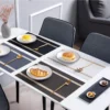 Placemat Atque G 30x45 cm digunakan sebagai alas piring dalam penataan meja makan