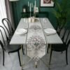 Table runner Russelia off white dengan motif floral sebagai dekorasi meja makan
