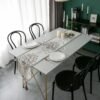 Detail table runner Russelia off white dengan motif floral pada meja